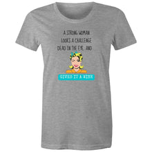 Load image into Gallery viewer, Stand tall with this t-shirt featuring the empowering quote: 'A Strong Woman Looks a Challenge Dead in the Eye and Gives It a Wink.' Our positive message t-shirts are designed to spread confidence and uplift spirits with every wear, making them a must-have for women who embrace their strength and resilience.