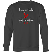 Load image into Gallery viewer, Stay cosy and stylish in our women's oversized sweatshirt featuring the empowering slogan, 'Keep Your Heels, Head, and Standards High.' This relaxed-fit sweatshirt offers ultimate comfort and modern fashion, making it the perfect choice for those seeking fashionable, comfortable everyday wear.