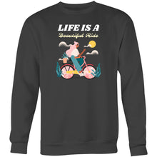 Load image into Gallery viewer, Stay cosy in our women's relaxed fit sweatshirt featuring the uplifting slogan 'Life is a Beautiful Ride'. This fashionable oversized sweatshirt combines comfort and style, perfect for casual days. Discover your new favourite comfortable sweatshirt for a laid-back, effortless look!