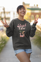 Load image into Gallery viewer, Keep the essence of summer alive year-round with our 'Beach Vibes' relaxed fit sweatshirt. This oversized sweatshirt is the epitome of comfort and warmth. Soft, cosy, and capturing the laid-back essence of seaside life in every thread, it's perfect for those who cherish the spirit of seaside serenity on even the chilliest days.