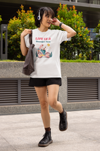 Load image into Gallery viewer, Explore our women's 100% organic T-shirt with the inspiring message 'Life is a Beautiful Ride'. Made from premium organic cotton, this eco-friendly tee combines style with sustainability. Shop the best organic clothing for a positive impact and elevate your wardrobe with top quality, sustainable fashion.