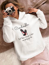 Load image into Gallery viewer, Discover our unisex hoodie featuring the slogan: "Cinderella - proof that a new pair of shoes can change your life." Perfect for those who love fashionable oversized, relaxed fit hoodies, and trendy unisex streetwear. Elevate your style with this timeless and comfy statement piece today!