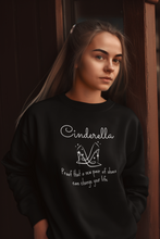 Load image into Gallery viewer, Shop our latest unisex oversized crew sweatshirt featuring the iconic slogan: 'Cinderella - proof that a new pair of shoes can change your life.' Perfect for lovers of relaxed, streetwear fashion, this statement piece blends comfort with a timeless fairytale twist. Elevate your wardrobe today!