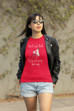 Load image into Gallery viewer, Empower your wardrobe with our women's t-shirt featuring the inspirational quote 'Don't look back, you're not going that way.' This positive quotes t-shirt combines style and motivation, making it the perfect choice for those who love wearing empowering messages.