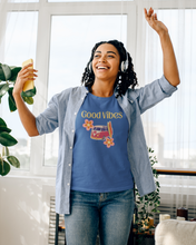 Load image into Gallery viewer, Embrace iconic retro wear with our 'Good Vibes' graphic t-shirt. Perfect for women who love a throwback style, this retro clothing staple combines timeless design with modern comfort. Elevate your wardrobe with a must-have women’s tee that spreads positivity in every outfit.