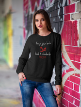 Load image into Gallery viewer, Stay cosy and stylish in our women's oversized sweatshirt featuring the empowering slogan, 'Keep Your Heels, Head, and Standards High.' This relaxed-fit sweatshirt offers ultimate comfort and modern fashion, making it the perfect choice for those seeking fashionable, comfortable everyday wear.