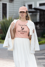Load image into Gallery viewer, Elevate your wardrobe with our women's affirmation t-shirt featuring the empowering quote, 'Keep Your Heels, Head, and Standards High.' This inspirational message tee is perfect for spreading positivity and confidence. Shop now for stylish, positive message apparel that motivates and empowers!
