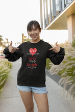 Load image into Gallery viewer, Embrace comfort and style with our women's relaxed fit sweatshirt featuring the uplifting message 'Live, Love, Laugh.' This modern, oversized sweatshirt combines a fashionable look with a cosy feel, perfect for those who love comfortable, trendy, and relaxed fit designs.