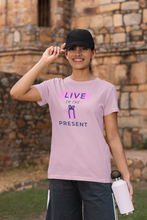 Load image into Gallery viewer, Elevate your style with our women's message t-shirt featuring the empowering slogan 'Live in the Present.' This inspirational tee combines comfort with motivation, offering positive vibes and an uplifting quote. Shop now for fashionable and motivational t-shirts that inspire!