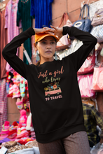 Load image into Gallery viewer, Stay cosy and stylish with this 'Just a Girl Who Loves to Travel' sweatshirt. Designed with a modern oversized fit, it's perfect for those who value comfort and fashion. This relaxed-fit sweatshirt is ideal for travel lovers who want a fashionable, comfortable layer for any adventure.