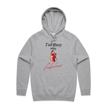 Load image into Gallery viewer, Stay cosy and stylish with our women's relaxed fit hoodie featuring the slogan 'Too Busy Being Fabulous.' This modern, oversized hoodie offers a perfect blend of fashion and comfort, ideal for those who love trendy, relaxed fit women's hoodies with a chic vibe.