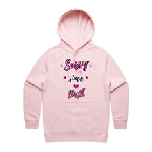 Load image into Gallery viewer, Own your sass with the ‘Sassy Since Birth’ pocket hoodie – featuring a bold graphic design and cosy cotton blend. Perfect for comfort with attitude.
