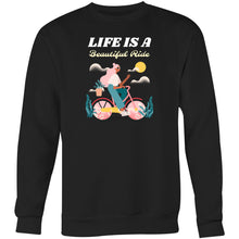 Load image into Gallery viewer, Stay cosy in our women&#39;s relaxed fit sweatshirt featuring the uplifting slogan &#39;Life is a Beautiful Ride&#39;. This fashionable oversized sweatshirt combines comfort and style, perfect for casual days. Discover your new favourite comfortable sweatshirt for a laid-back, effortless look!
