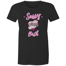 Load image into Gallery viewer, Black organic cotton t-shirt with “Sassy Since Birth” printed in bold pink and white text, featuring hearts, stars, and a pink watercolour splash design.
